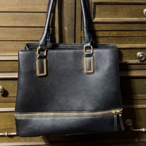 Black purse with gold accents